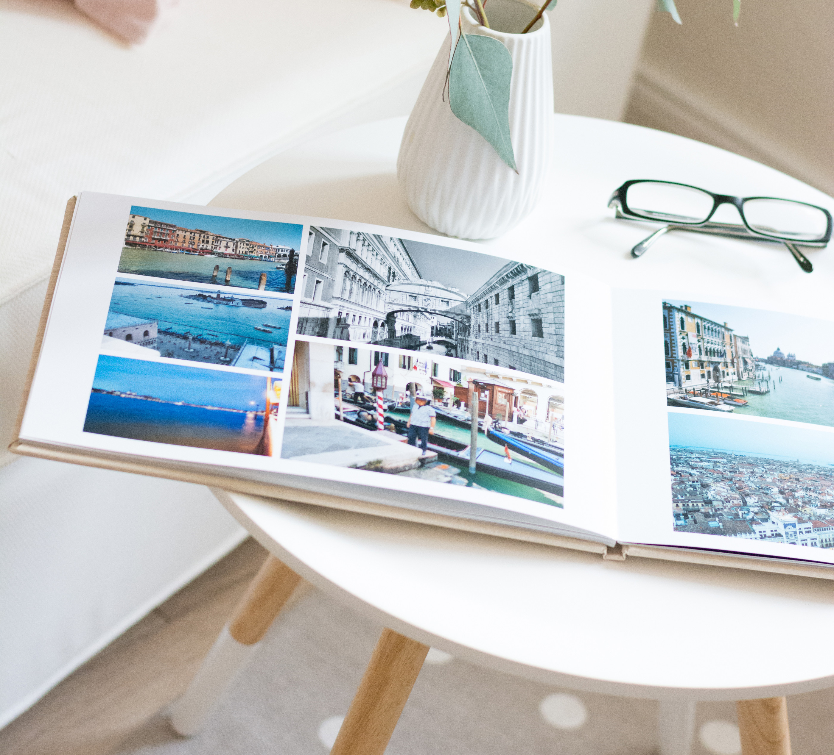 Premium Photo  Photobook album on deck table with travel photos